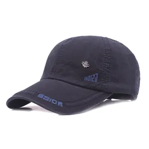 Detail of navy cotton baseball cap with GSIOR embroidery and silver maple leaf badge