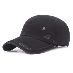 Detail of black cotton baseball cap showing GSIOR embroidery and metal maple leaf badge