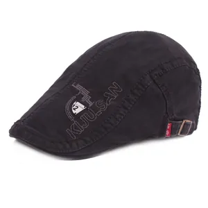 Classic black cotton newsboy beret hat with embroidery and side shield patch detail