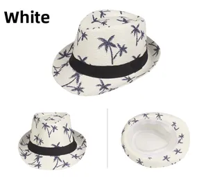 Detailed view of white straw fedora hat featuring blue palm tree patterns and black band