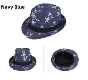 Detail view of navy blue summer straw fedora with white palm tree prints and black ribbon