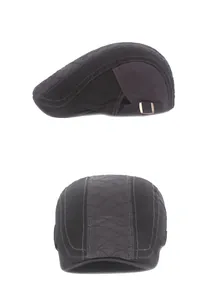 Detail showing contrast stitching and adjustable copper buckle on the cotton beret hat