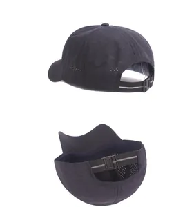 Detail of black quick-dry baseball cap featuring breathable laser-cut holes and reflective strap