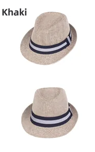 Detail view of khaki woven straw fedora hat featuring a stylish striped navy band