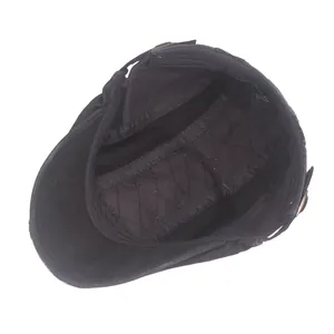 Men's black cotton flat cap featuring quilted inner lining and sweatband detail