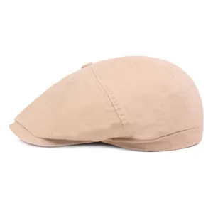 Classic khaki cotton flat cap with structured panels and side stitching on white background