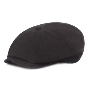 Classic black cotton newsboy cap with vintage eight-panel design and short brim