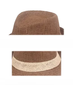 Close-up of brown straw fedora hat featuring breathable mesh texture and cream band