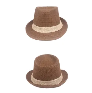 Detailed view of dark brown woven straw fedora hat featuring a beige hollowed-out band