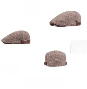 Three-angle view of a cotton herringbone flat cap with orange plaid and side leather strap