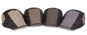 Detail view of four vintage cotton beret hats in khakis and greys with diamond stitching