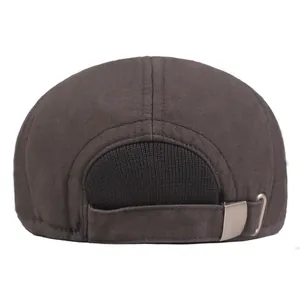 Back view of a thick warm winter beret hat with adjustable metal buckle and ear protection