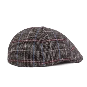 Side view of men's thick plaid beret hat with classic grey and blue tweed texture