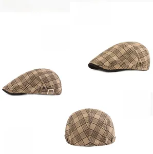 Detail of plaid ivy cap showing cotton fabric texture and side metal adjustment buckle