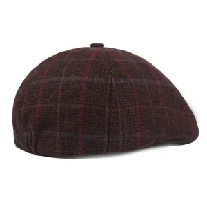 Detail shot of vintage dark brown plaid flat cap with red and blue checkered pattern