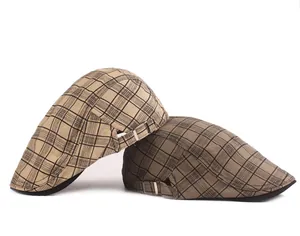Detail view of mesh texture and adjustable metal buckle on plaid ivy flat caps