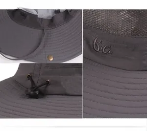 Detail view of dark grey sun hat showing breathable mesh and Outdoors embroidery