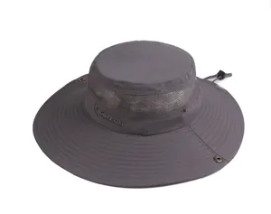 Detail of grey sun hat featuring breathable mesh layer and embroidered outdoors logo