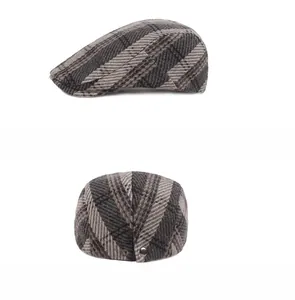 Detail showing vintage plaid pattern and metal buckle on wool blend newsboy cap