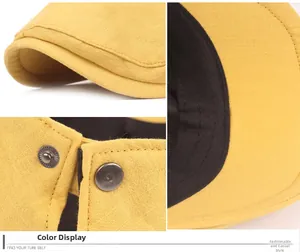 Detail of yellow cotton-linen beret featuring metal adjustable buckle and precise stitching