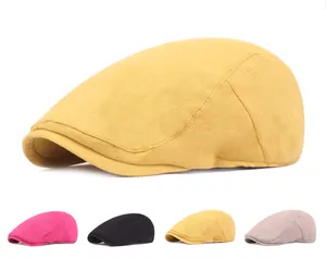 Detail view of cotton flat cap showing stitching texture and four color options