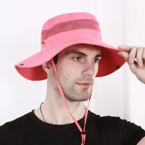 Detail of pink outdoor sun hat with breathable mesh, wide brim and adjustable chin strap