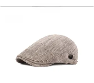 Detail of coffee herringbone flat cap with adjustable side buckle and retro texture