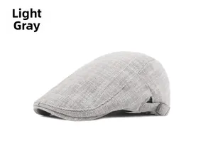 Detail of light grey herringbone beret showing high-quality fabric and metal buckle