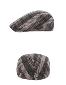 Macro detail of plaid wool blend flat cap with adjustable metal snap buttons