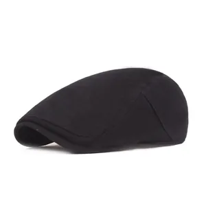 Close-up of a classic black beret cap featuring solid color texture and precise stitching