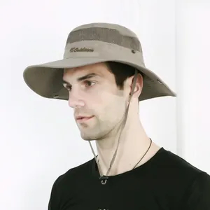 Detail of khaki outdoor sun hat featuring breathable mesh panels and adjustable chin strap