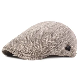 Classic herringbone flat cap in brown tweed with metal side buckle adjustment detail