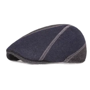 Navy blue herringbone wool beret with ear protection and contrast stitching for men