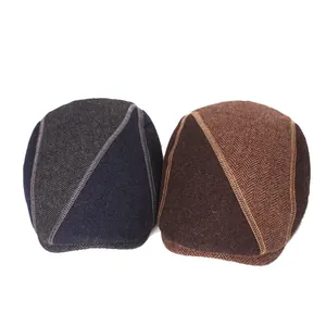 Detail of wool beret with herringbone pattern and decorative stitching for men