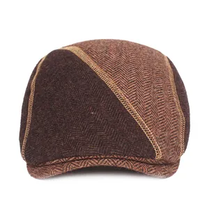 Mens winter wool blend flat cap with brown herringbone pattern and stitching detail