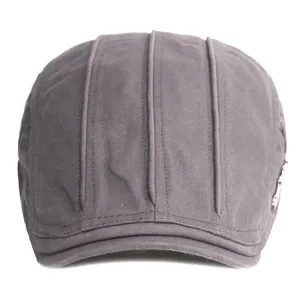 Dark gray twill cotton flat cap with vertical top stitching and side metal button accent