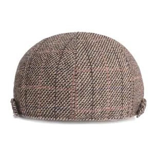 Rear view of plaid ivy cap in brown tweed with subtle red and blue line accents