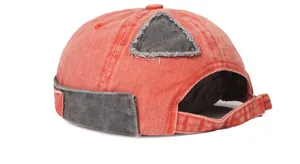 Detailed back view of vintage orange washed cotton docker cap with adjustable strap