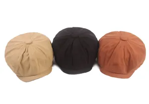 Three-color newsboy caps in tan, black, and caramel shown in a side-by-side display