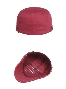 Detail view of burgundy cotton ivy cap showing adjustable side buckle and interior structure