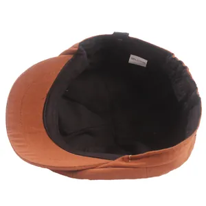 Brown 100% cotton newsboy cap featuring premium twill fabric and interior lining