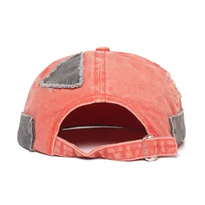 Back view of washed canvas docker hat with adjustable metal buckle and frayed patch