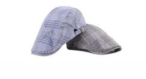 Detailed close-up of striped ivy flat caps showing breathable fabric and metal side buckles