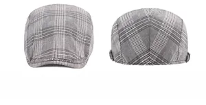 Close-up of gray plaid beret cap fabric showing fine stitching and sewing craft details