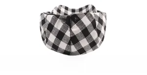 Detail of classic black and white plaid fabric with metal snap button and neat stitching