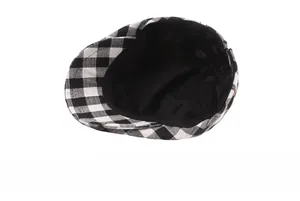 Detail view of the black and white checkered ivy cap featuring smooth inner lining