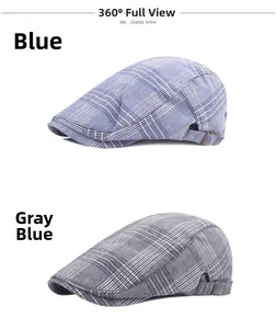 Detail of blue and gray plaid newsboy hats with adjustable metal buckles and breathable fabric