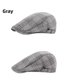 Detail view of grey striped flat cap featuring side metal buckle and tweed texture