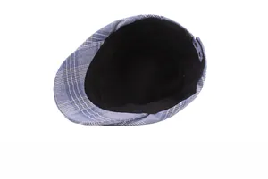Interior detail of striped ivy cap showing black lining and adjustable strap buckle