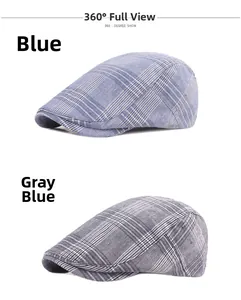 Detail of plaid newsboy caps in blue and gray blue with breathable cotton texture